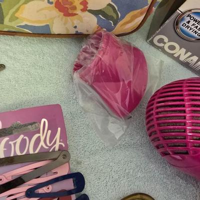Bathroom scale - curling irons - hairdryer - and an assortment of other beauty products