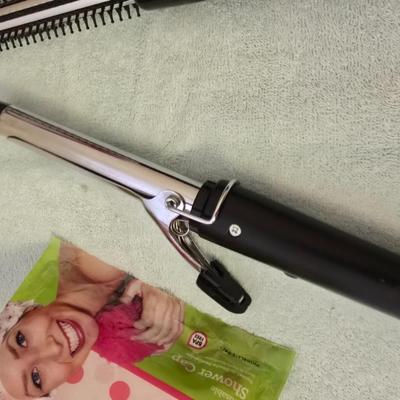 Bathroom scale - curling irons - hairdryer - and an assortment of other beauty products