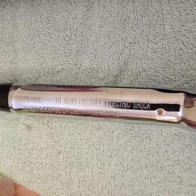 Bathroom scale - curling irons - hairdryer - and an assortment of other beauty products