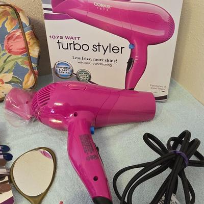 Bathroom scale - curling irons - hairdryer - and an assortment of other beauty products