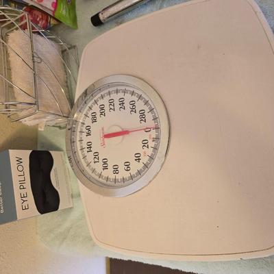 Bathroom scale - curling irons - hairdryer - and an assortment of other beauty products