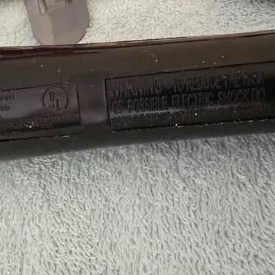 Bathroom scale - curling irons - hairdryer - and an assortment of other beauty products