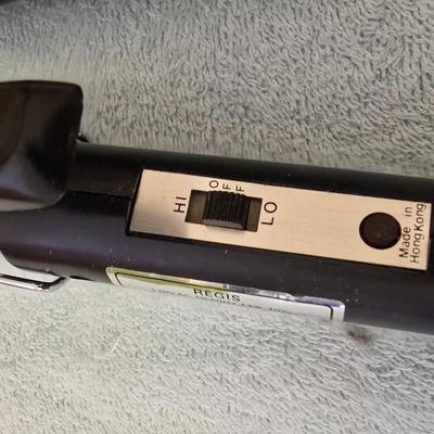 Bathroom scale - curling irons - hairdryer - and an assortment of other beauty products