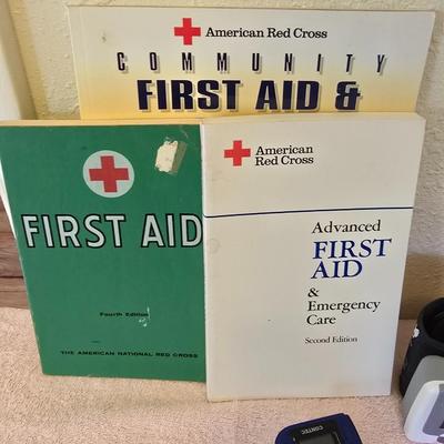 First Aid kit with books - Blood pressure monitor - o2 sensor - thermometer and other health related aides