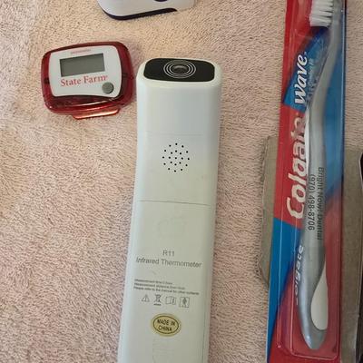 First Aid kit with books - Blood pressure monitor - o2 sensor - thermometer and other health related aides