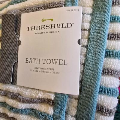 Bath robe, hair curlers, assortment of beauty liquids, brand new bath towel and two other nice towels