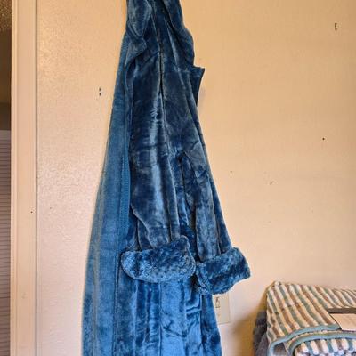 Bath robe, hair curlers, assortment of beauty liquids, brand new bath towel and two other nice towels