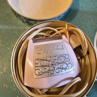 Vintage Lady Dazey Hair dryer, two vintage women's electric razors and vintage foot Massager