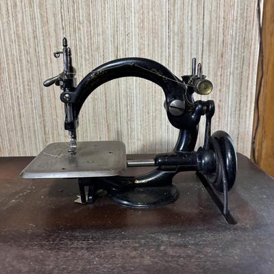 LOT 87: Vintage Wilcox & Gibbs Sewing Machine on Base.