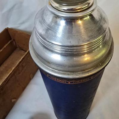 LOT 114: Rubbermaid Cooler, Thermos Picnic Jug, Thermos and UnoVac Vacuum Bottles