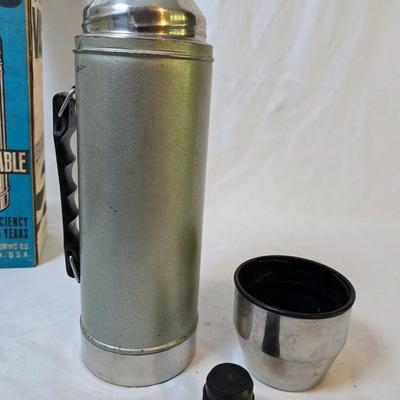 LOT 114: Rubbermaid Cooler, Thermos Picnic Jug, Thermos and UnoVac Vacuum Bottles