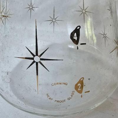LOT 121: Retro Mushroom Decor with Corning Ware, Pyrex and Milk Glass Mugs, and Aprons