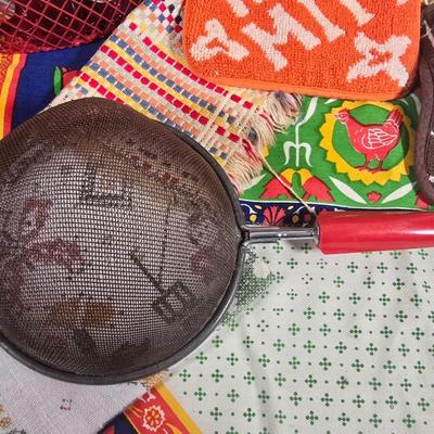 LOT 123: Copper Bundt Pans with Vintage Kitchen Gadgets and Cookie Cutters, Betty Crocker Points, Aprons, Tea Towels and Napkins