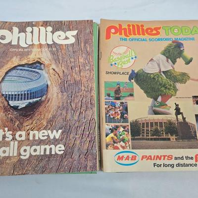 LOT 125: Vintage Phillies Yearbooks, Posters, Ticket Stubs with Pete Rose Newspaper Clipping and Baseball Book
