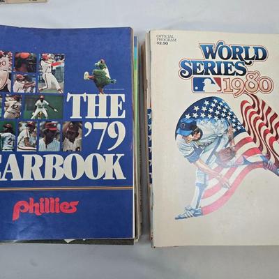 LOT 125: Vintage Phillies Yearbooks, Posters, Ticket Stubs with Pete Rose Newspaper Clipping and Baseball Book