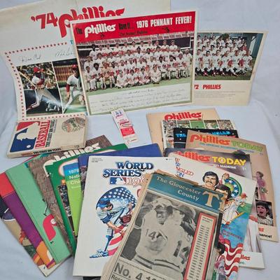 LOT 125: Vintage Phillies Yearbooks, Posters, Ticket Stubs with Pete Rose Newspaper Clipping and Baseball Book