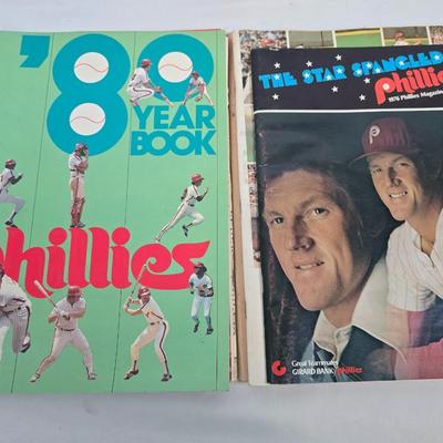 LOT 125: Vintage Phillies Yearbooks, Posters, Ticket Stubs with Pete Rose Newspaper Clipping and Baseball Book