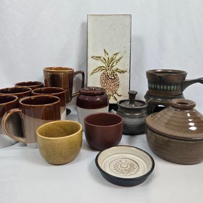 LOT 135: Stoneware Collection in Brown Tones; Mugs, Butter Sauce Dish, Custard Cups, Jars and More