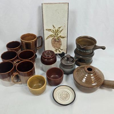 LOT 135: Stoneware Collection in Brown Tones; Mugs, Butter Sauce Dish, Custard Cups, Jars and More