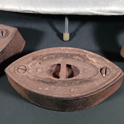 LOT 138: Antique Sad Irons, Metal Washboard, Miniature Ironing Board and Sleeve Ironing Board