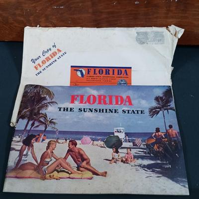 LOT 139: Wooden Magazine Rack with Vintage Travel Maps and Pamphlets