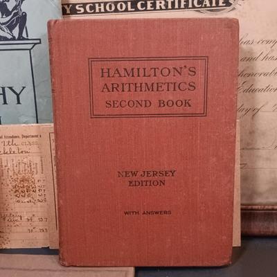 LOT 151: Vintique School Collection - 1920s School Certificates, Old King Cole Watercolor Tin, Children's Notebooks & More