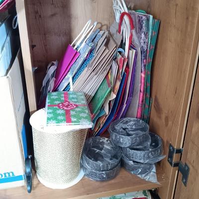LOT 153: Large Collection of Wrapping Paper, Gift Bags, Ribbons & More