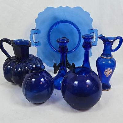 LOT 191: Colbalt Blue Glass Collection: Pitcher, Candlesticks, Plate and Vases