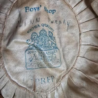 LOT 203: Wannamakers' Boys Shop Cap with Antique Pantaloons, Wool Shorts, and Ribbons