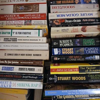 Large assortment of paperback books - Stuart Woods - Robert Parker - Connie Willis Lots of winter reading!