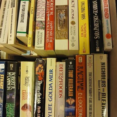 Large assortment of paperback books - Stuart Woods - Robert Parker - Connie Willis Lots of winter reading!