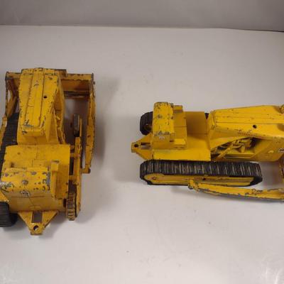 Pair of Vintage Cast Metal International Harvester Tractors