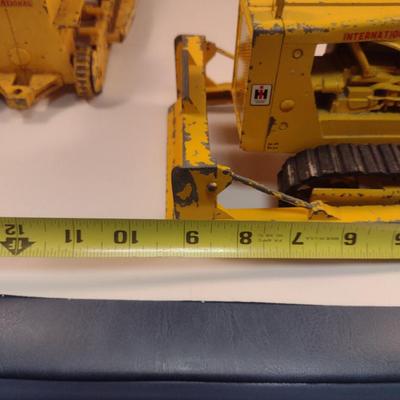 Pair of Vintage Cast Metal International Harvester Tractors