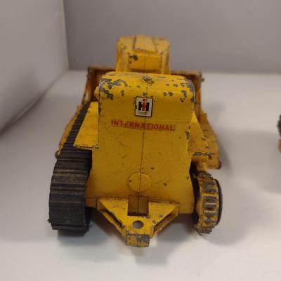 Pair of Vintage Cast Metal International Harvester Tractors