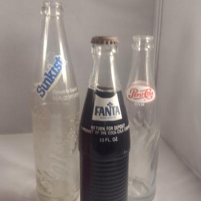 Plastic Coca-Cola Carrier and Assorted Bottles