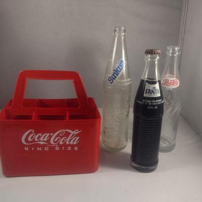 Plastic Coca-Cola Carrier and Assorted Bottles
