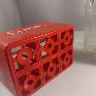 Plastic Coca-Cola Carrier and Assorted Bottles