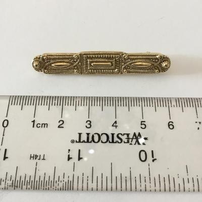 Vintage 1928 company goldtone brooch