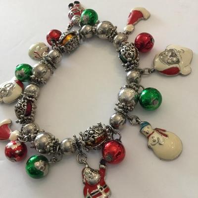Vintage enamel Christmas Santa charm bracelet. Metal bead super cute. Very nice.