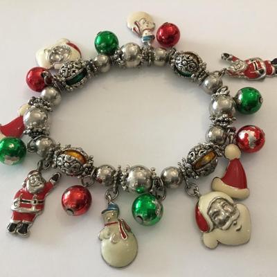 Vintage enamel Christmas Santa charm bracelet. Metal bead super cute. Very nice.