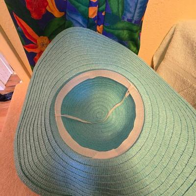 Two swin suits - sun hat - water shoes - and a robe