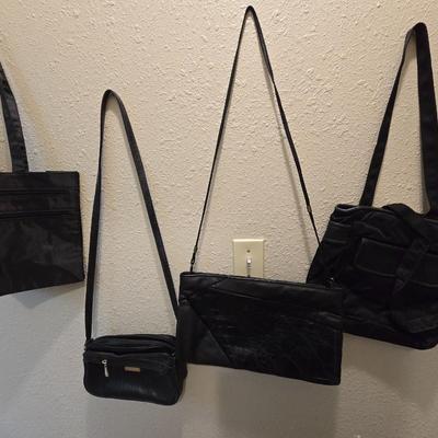 Four black purses