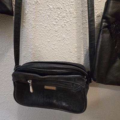 Four black purses