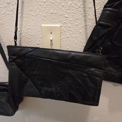 Four black purses
