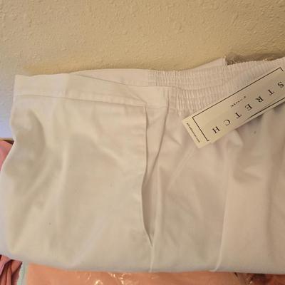 Brand new clothes with tags - shirts and slacks