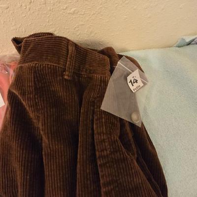 Brand new clothes with tags - shirts and slacks