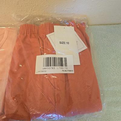 Brand new clothes with tags - shirts and slacks