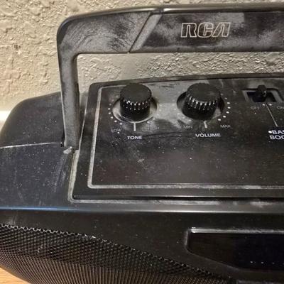 RCA Dual cassette deck am/fm radio with assortment of books on tape