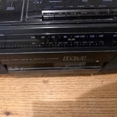 RCA Dual cassette deck am/fm radio with assortment of books on tape