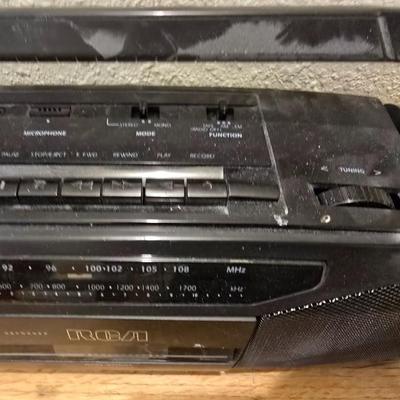 RCA Dual cassette deck am/fm radio with assortment of books on tape